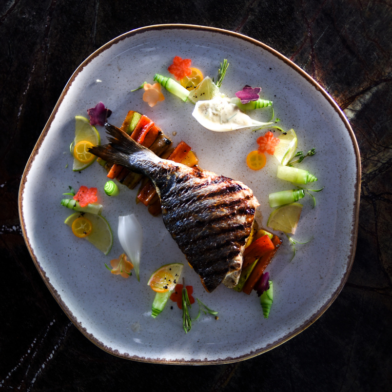 Grilled Fish Served on a Ceramic Plate